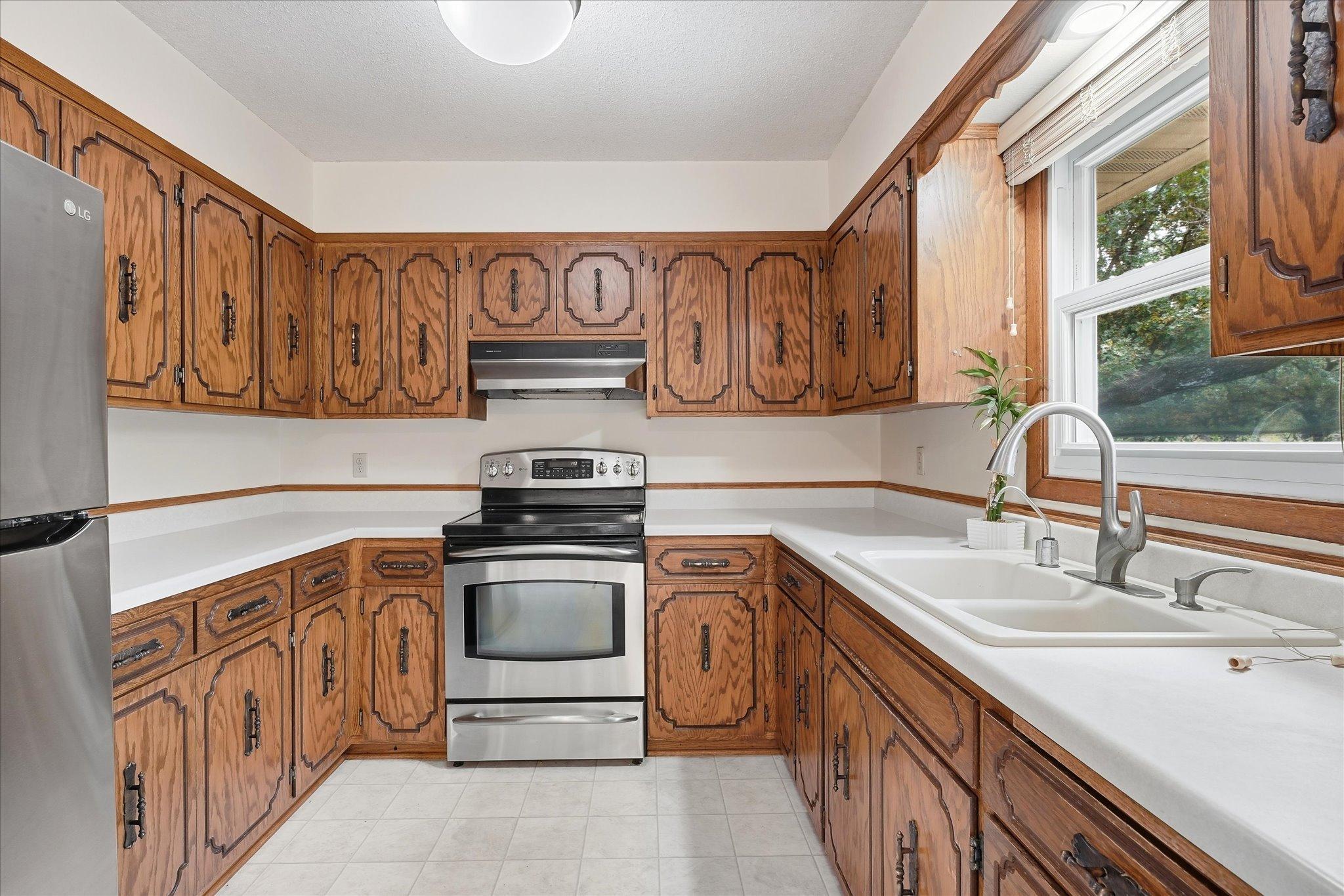 Extensive cabinet storage, generous workspace.