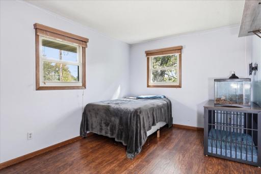 Second upper-level bedroom features easy-care flooring, two windows for abundant natural light, and plenty of flexibility for a bedroom, office, or guest space.