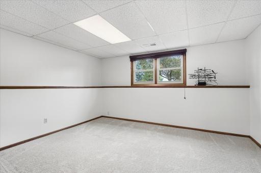 Spacious lower-level family room with a continuous display ledge that adds character and provides the perfect spot for dÃ©cor, photos, or collectibles.