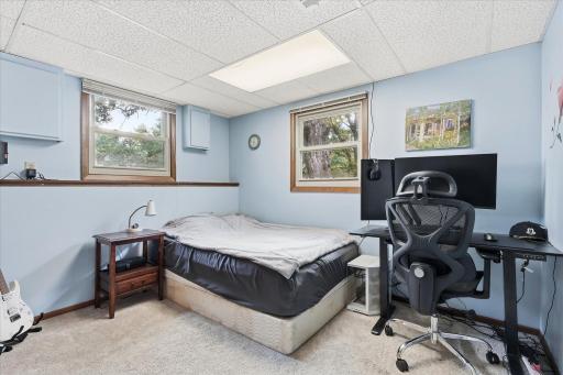 Comfortable lower-level bedroom #4 featuring new carpet, two windows and generous closet space.