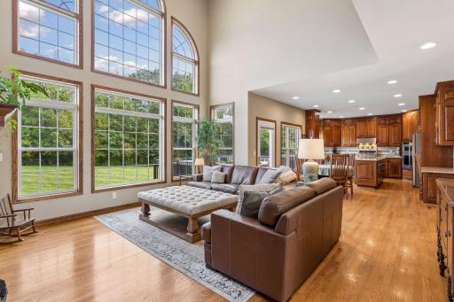 Floor-to-ceiling windows provide long views of the backyard.