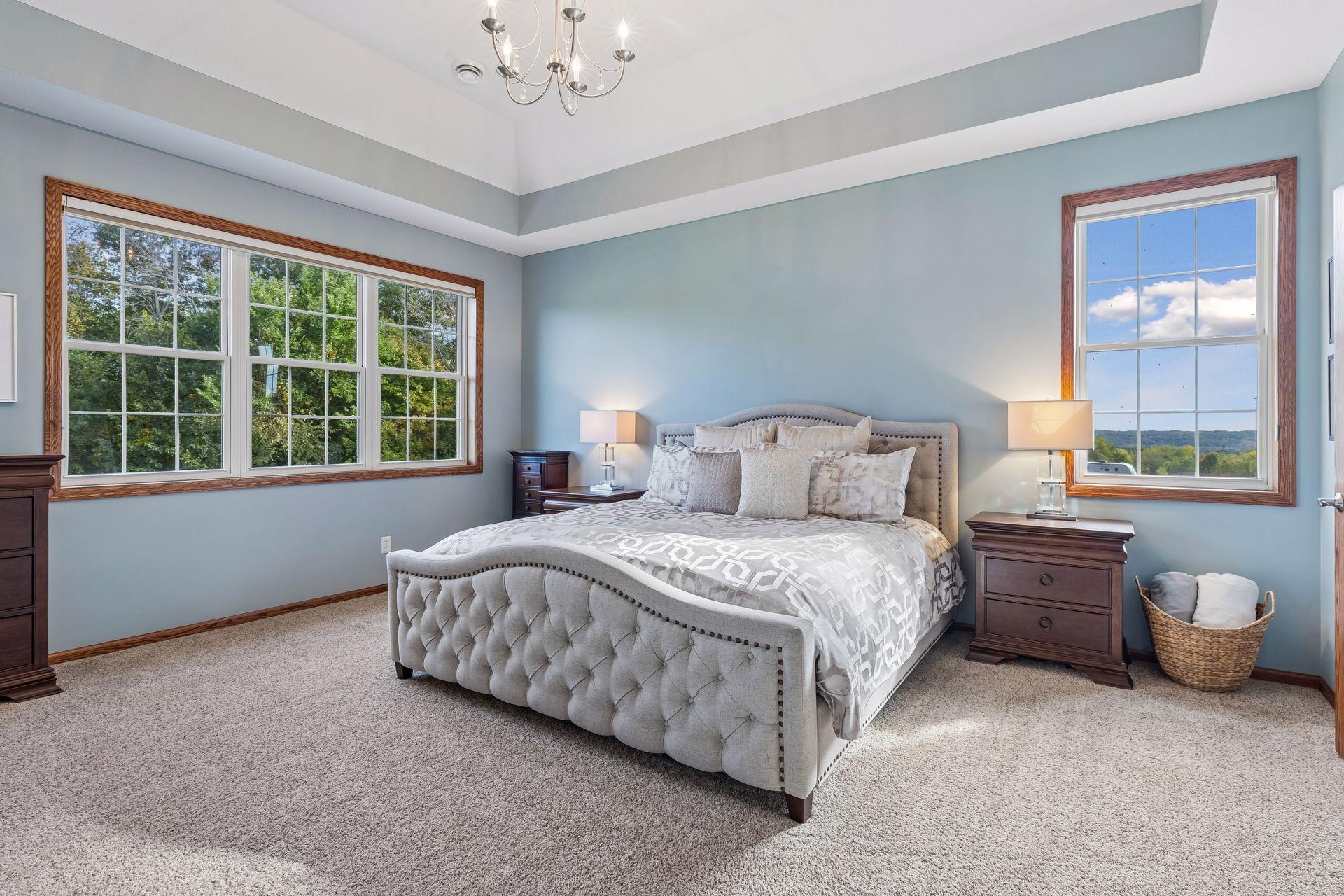 A tranquil retreat, the spacious Primary Bedroom offers panoramic views of the Minnesota River Valley.