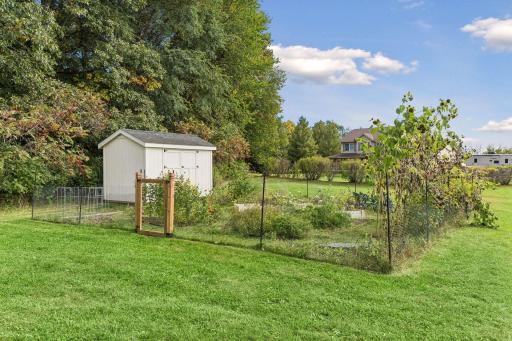 The fenced-in vegetable garden is ready for your plantings.