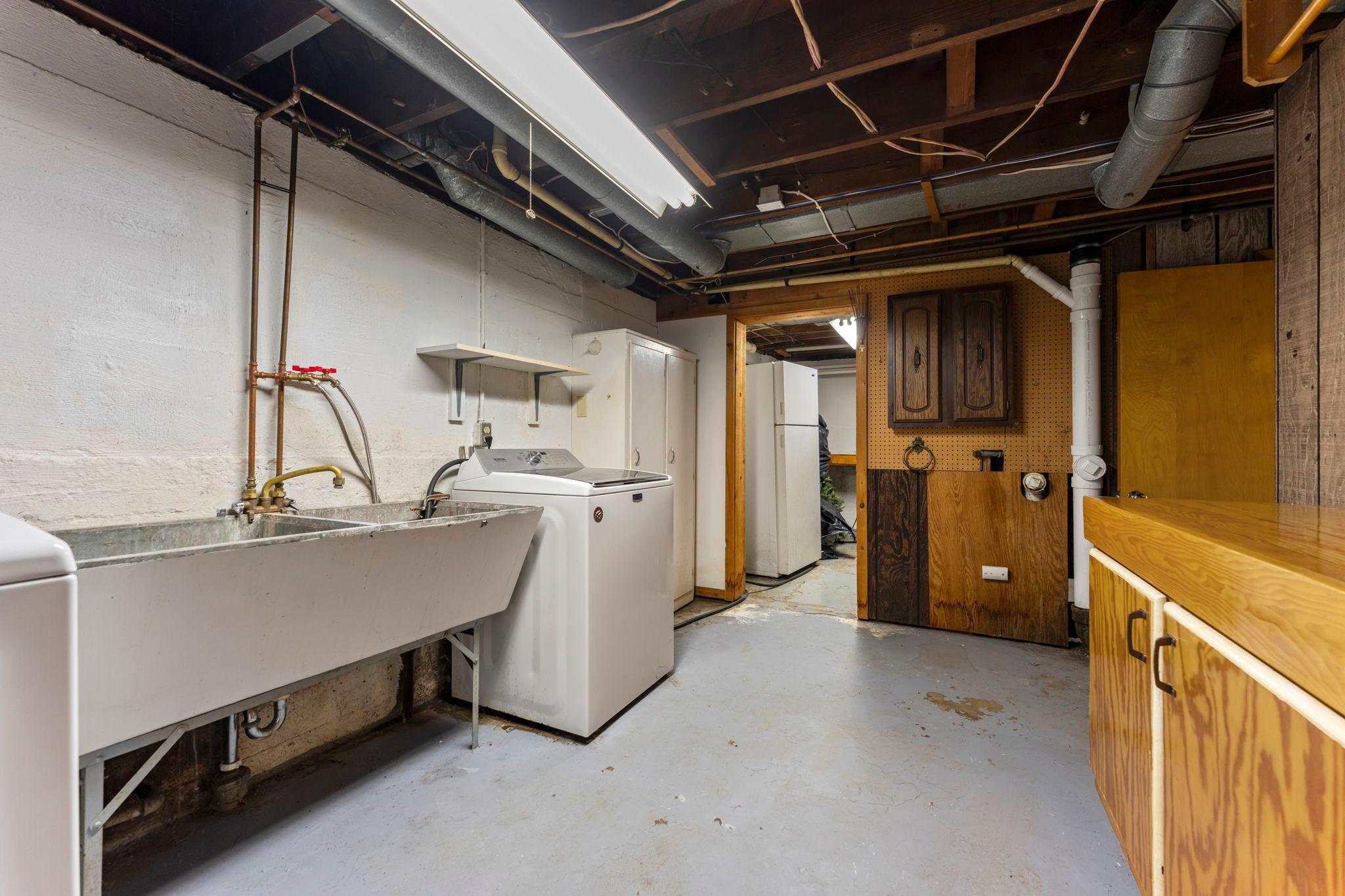 Lower Level Washer, Dryer, Laundry Tub, and Second Refrigerator