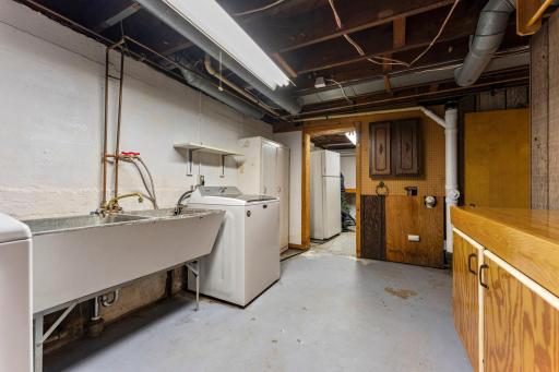 Lower Level Washer, Dryer, Laundry Tub, and Second Refrigerator