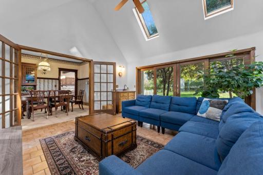 French Doors Leading From Formal Dining to Sun Room Including Wet Bar