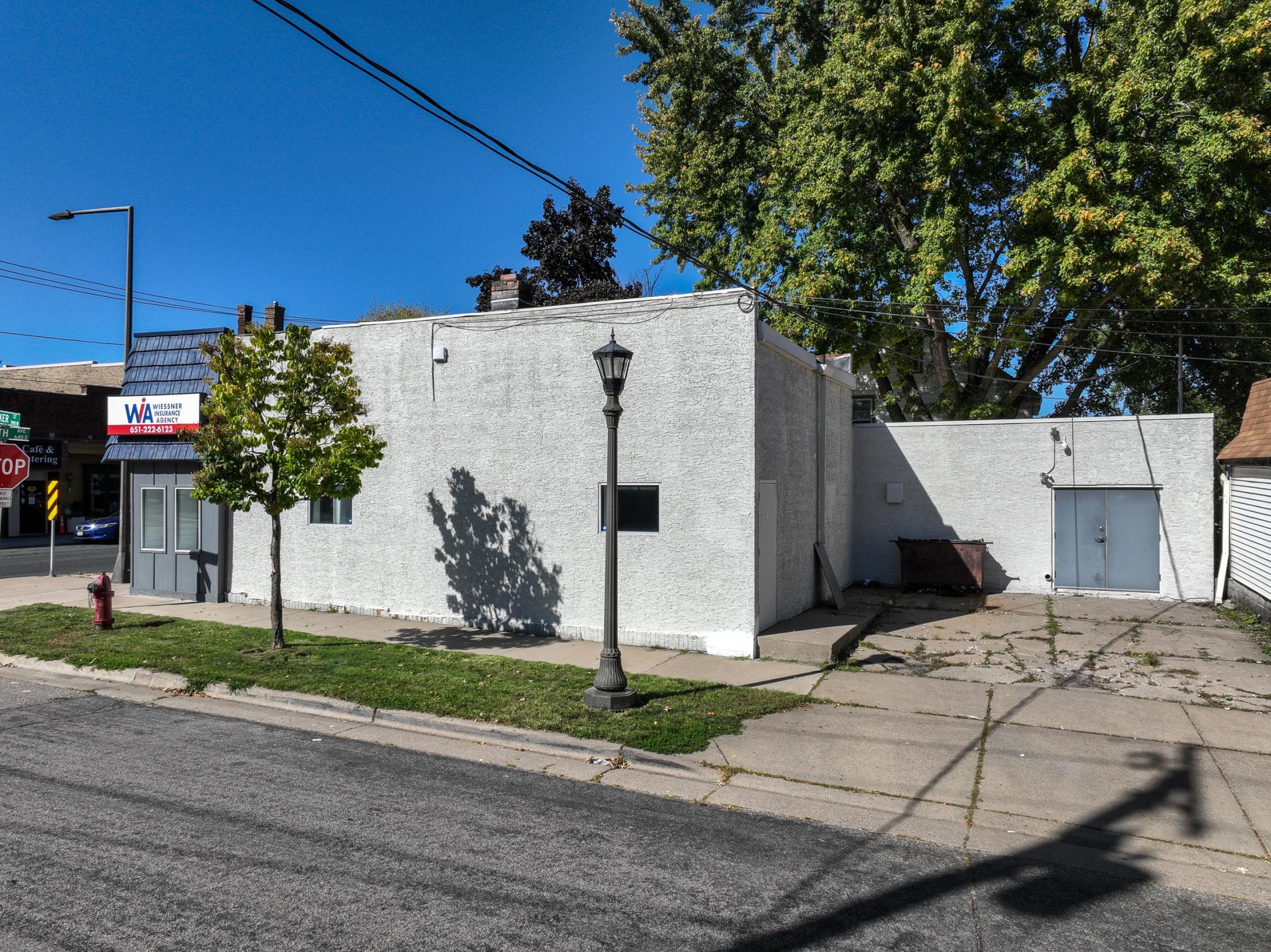 Back of Building With Parking Space and Delivery Doors
