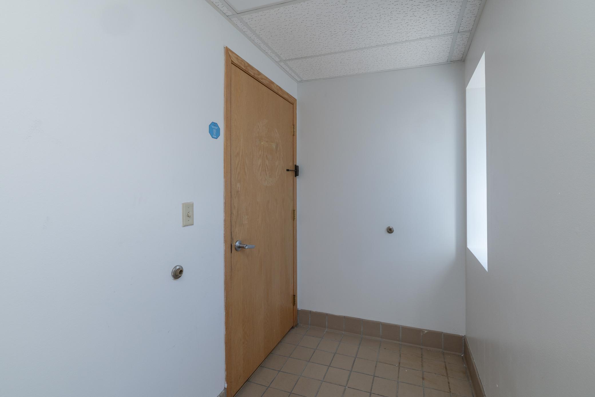 Main Entrance With Door to Separate Office Space on the South Side of The Building