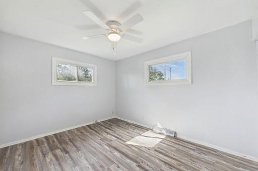 Bedrooms featuring updated lighting fixtures and modern ceiling fans.