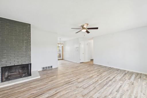 An inviting living space highlighted by a classic fireplace.