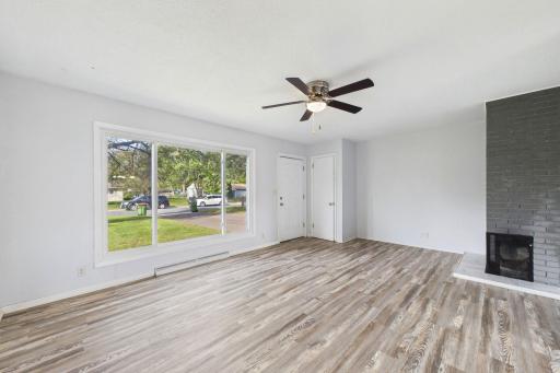Large picture windows flood the living area with sun.