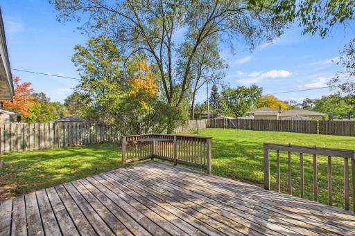 Expansive deck provides ample space for outdoor dining and relaxation.