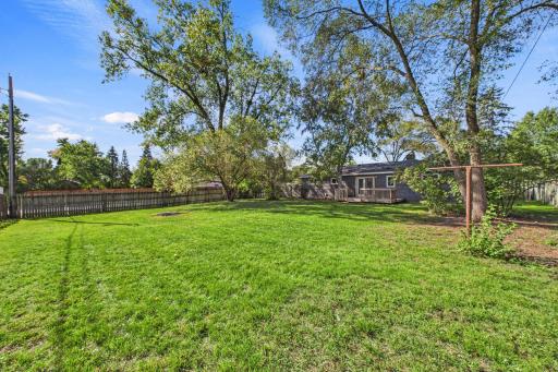 Sizable yard with significant potential for floral or vegetable gardens.