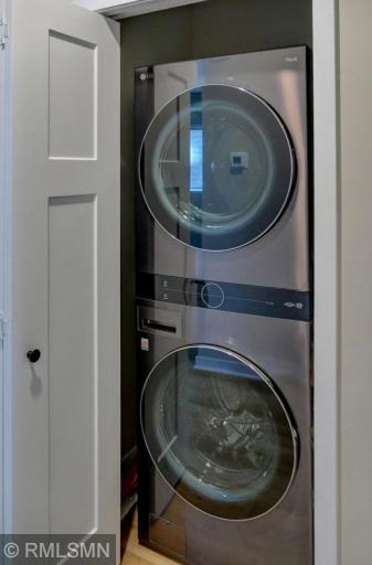 Laundry closet located the hallway between the kitchen and bedrooms.