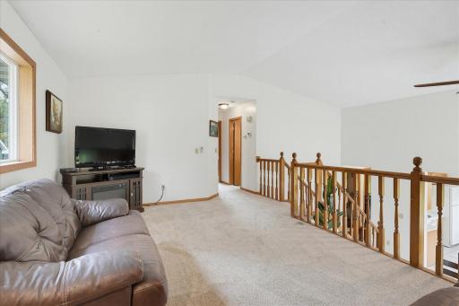 A second view shows the generous size of the living room with plenty of flexibility for multiple seating arrangements.