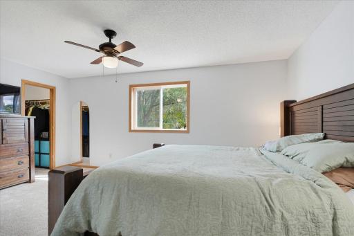 Comfortable primary suite includes a large walk-in closet and plenty of space for additional bedroom furniture.