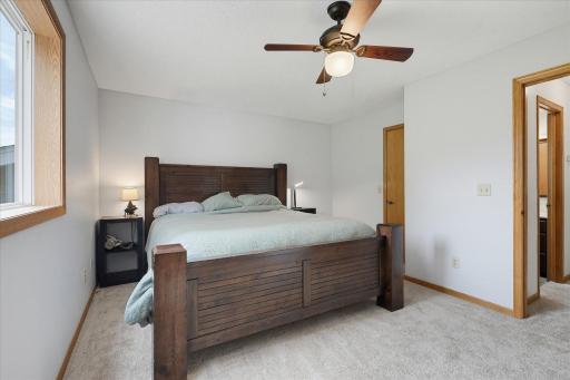 Primary bedroom offers convenient walk-through access to the full bathroom for added functionality.