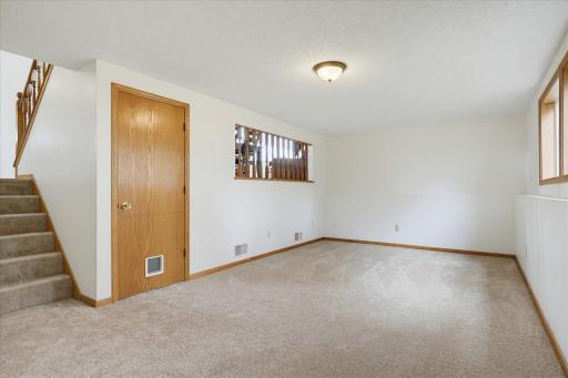 The generous layout provides plenty of flexibility for a large seating area, entertainment space, or game room.