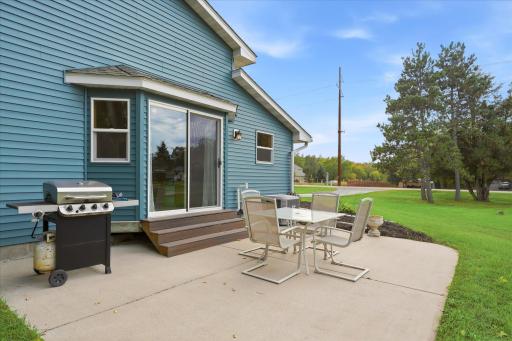 The spacious patio just off the dining room extends the living space outdoors, offering an ideal setting for grilling, dining, and entertaining.