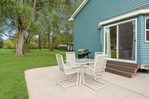 The patio along the side of the home creates a private outdoor retreat.