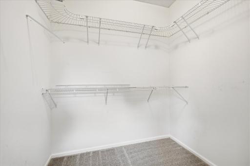 Large walk-in closet offers abundant storage, making staying organized a breeze!