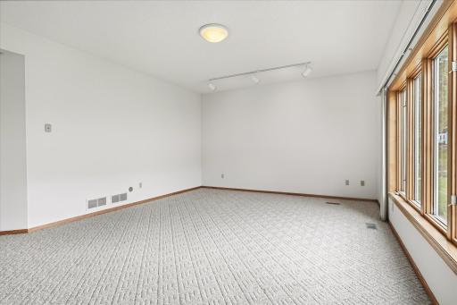 A light-filled lower level offers versatile space to relax, entertain, and make your own!