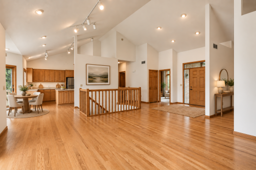 Timeless charm meets natural light in this inviting main-level living space, beautifully finished with warm hardwood floors! (Image virutally stage)