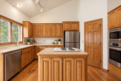 Spacious, inviting kitchen featuring updated appliances and a functional layout designed for everyday living and entertaining! (Image virtually staged)