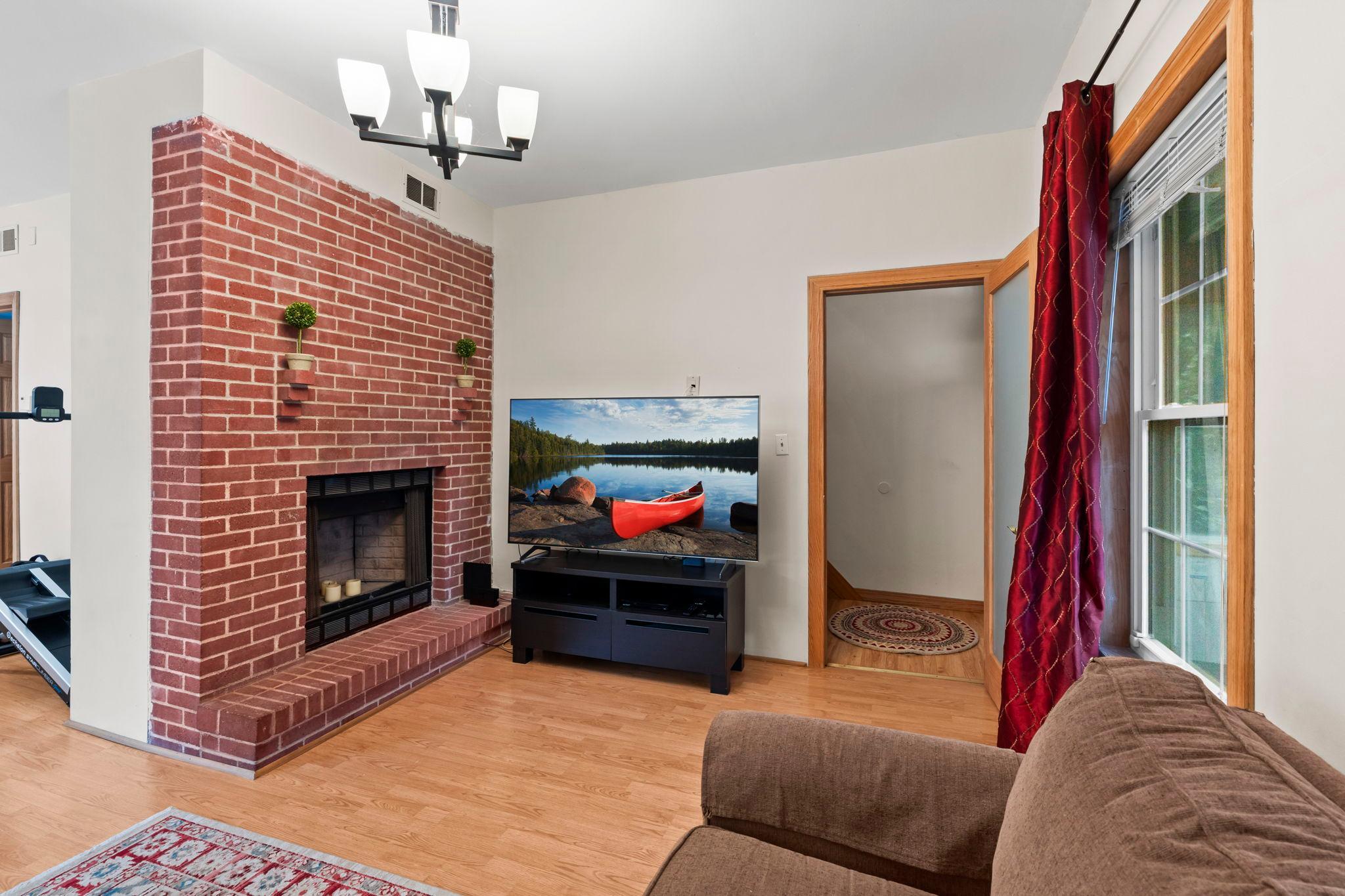 Living room with decorative fireplace