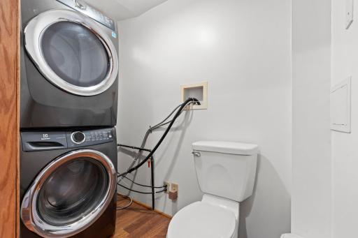 Main floor half bath with stackable laundry