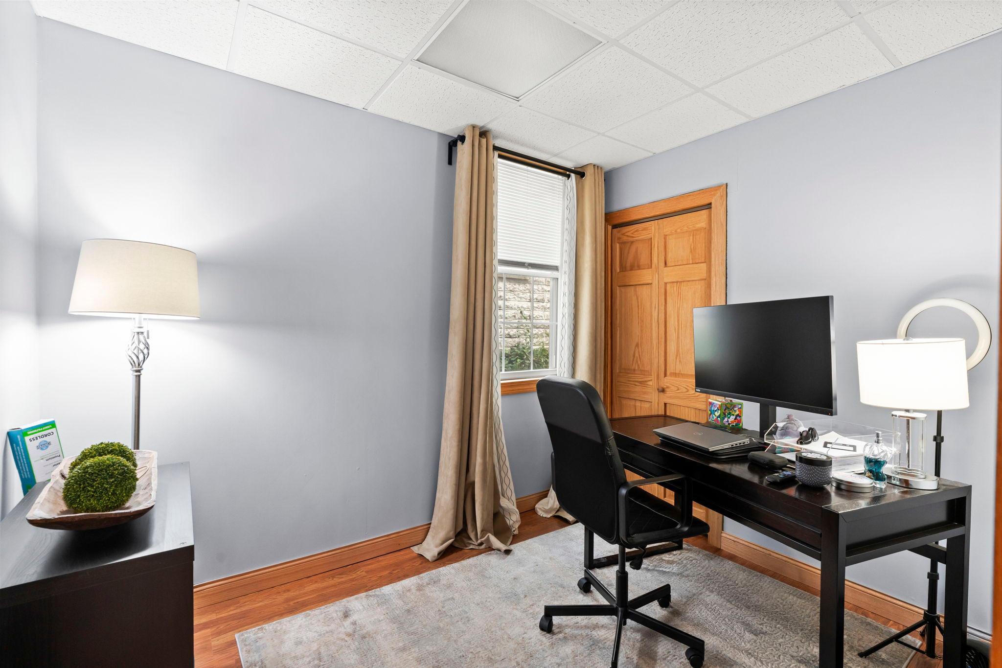 Main level bedroom that doubles as an office