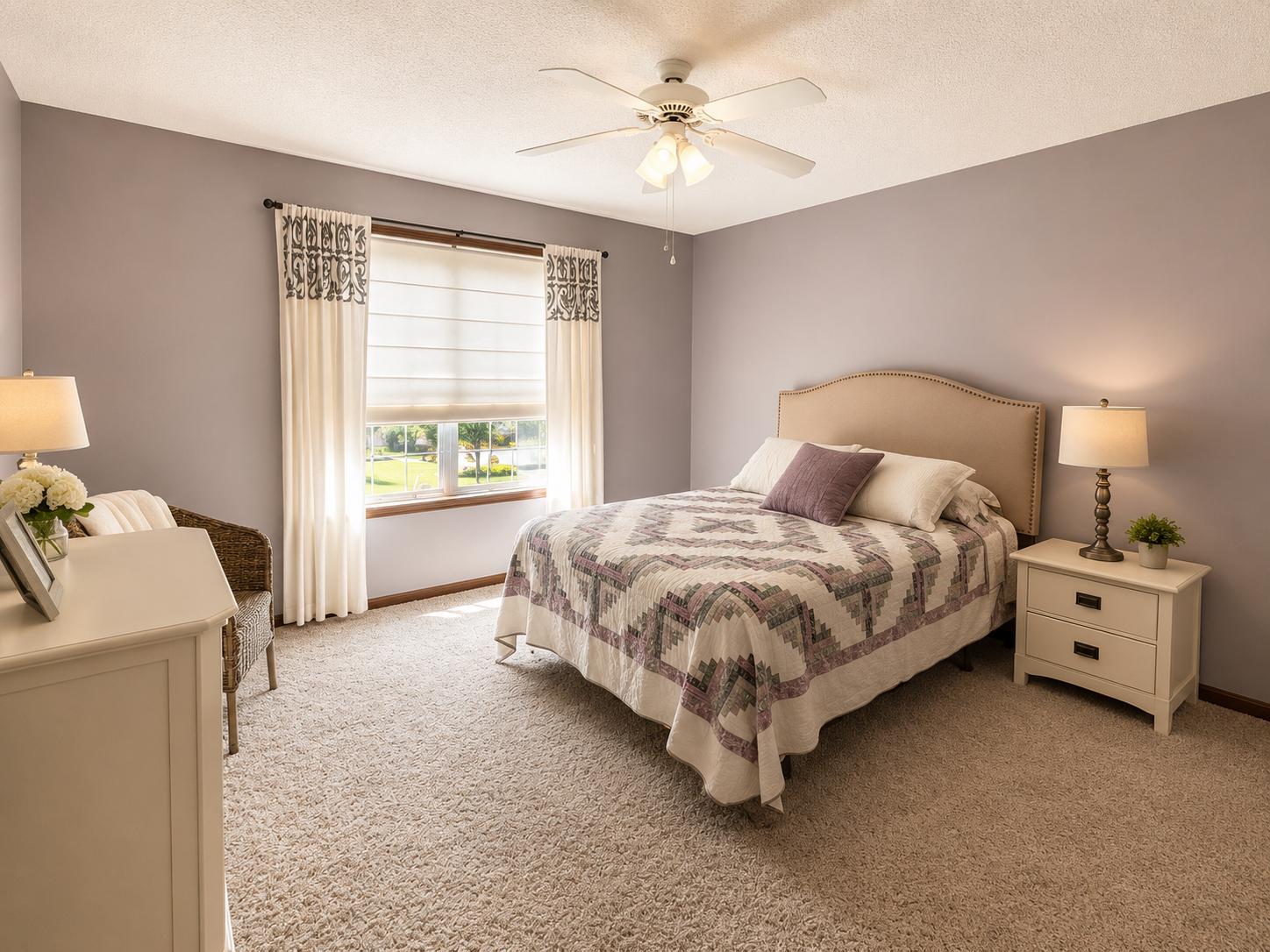Spacious upper-level bedroom with great natural light and comfortable living space.