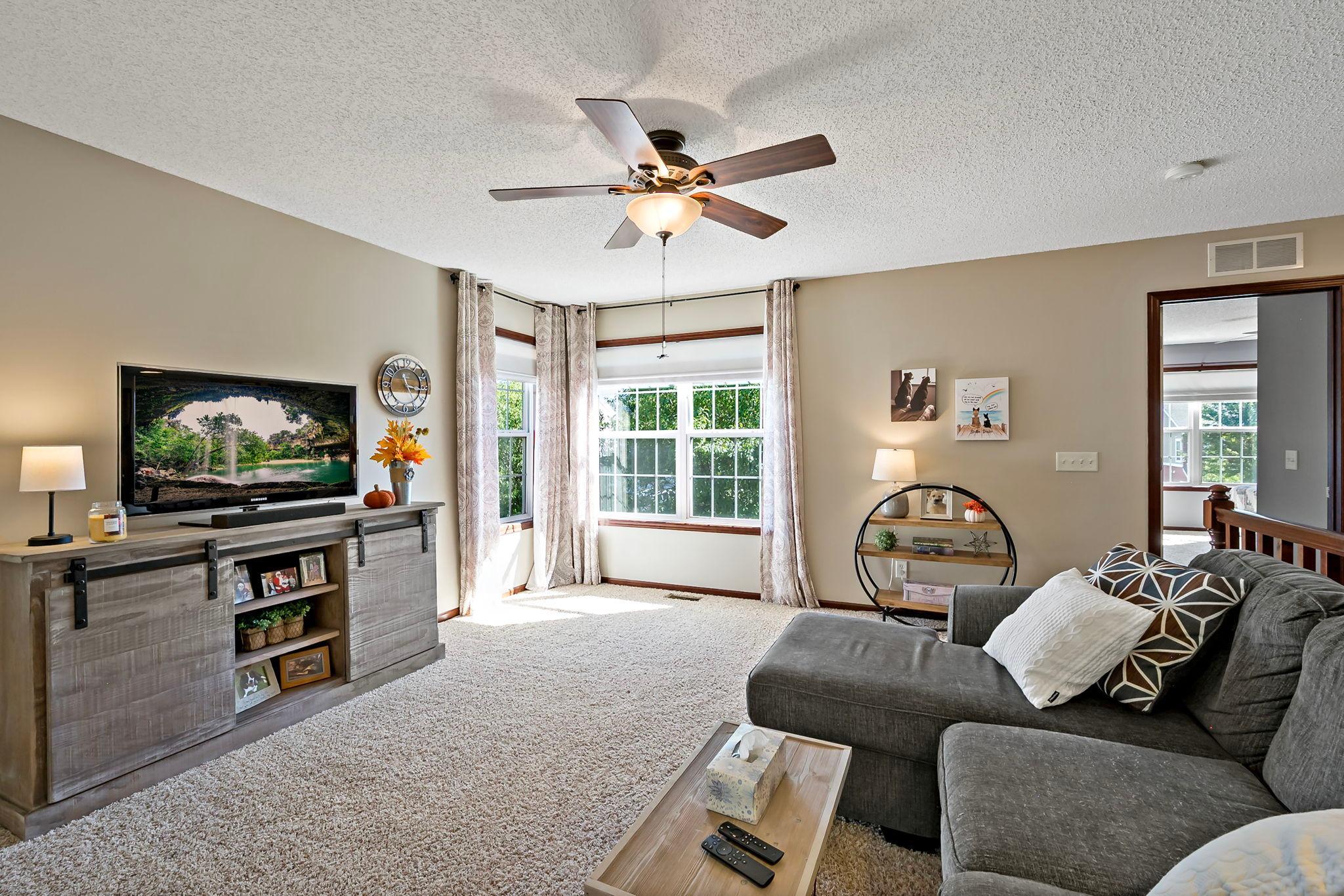 Upper-level loft provides additional living space, reading nook or home office potential.