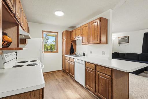 Kitchen with brand new flooring, a breakfast bar and great natural lighting that shines in from kitchen window
