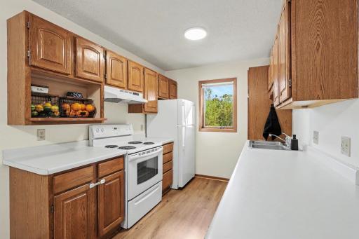 Kitchen with brand new flooring, a breakfast bar and great natural lighting that shines in from kitchen window