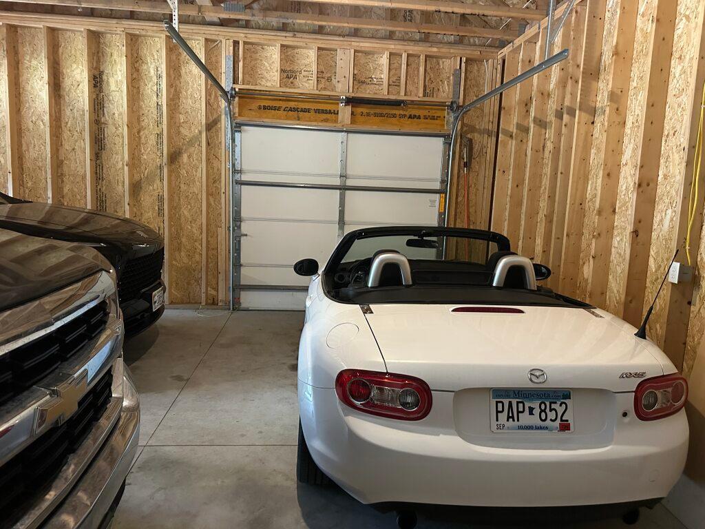 The front side of this garage can be for an additional vehicle, water toys or Mower/ Snow blower.