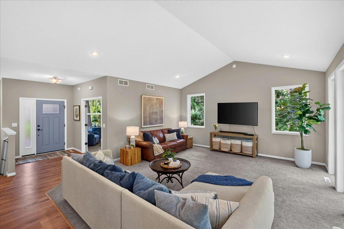 Vaulted ceilings help bring the openness of this room.