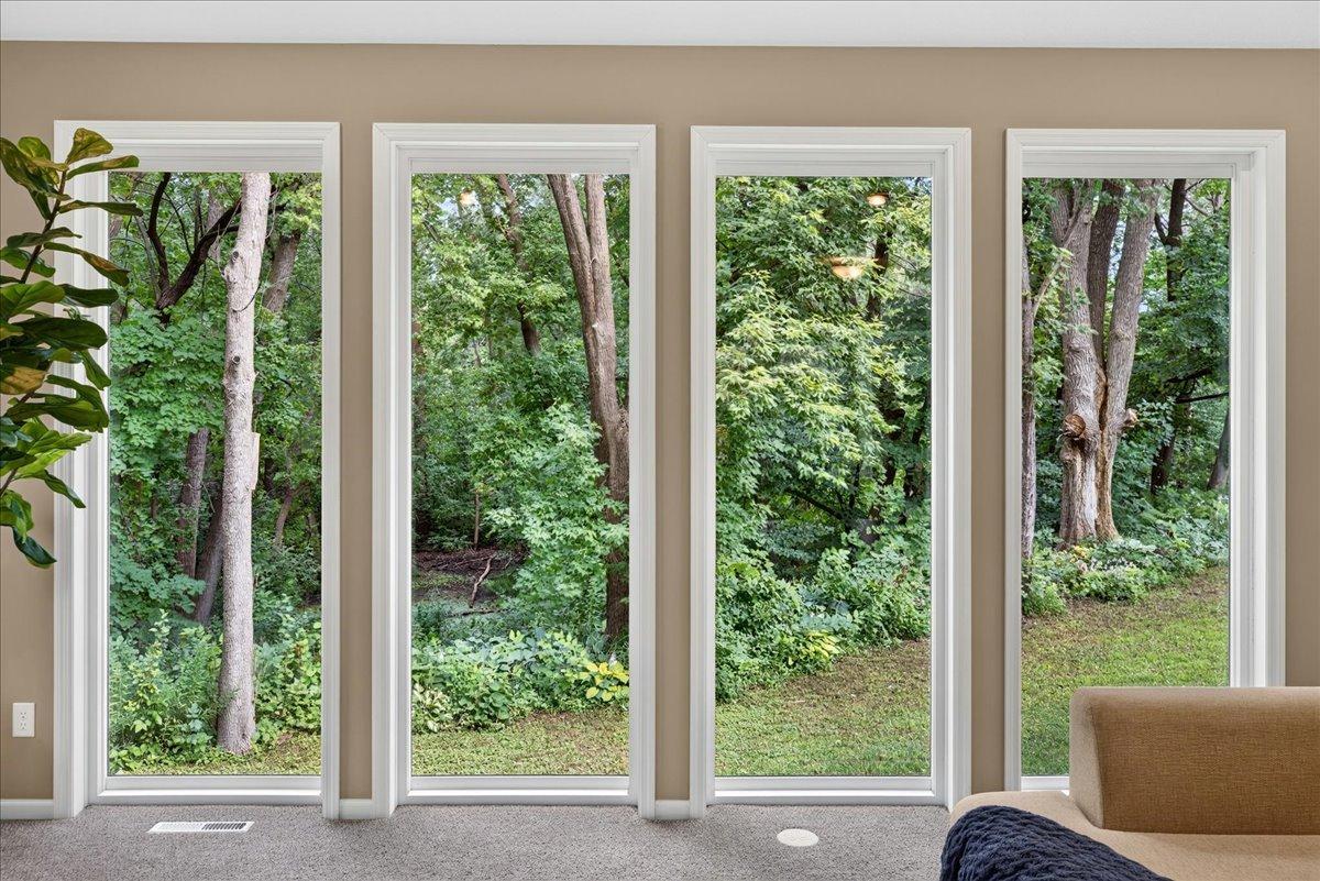 Large windows with views of your private wooded retreat.