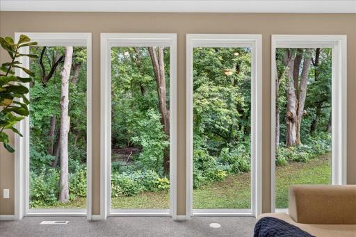 Large windows with views of your private wooded retreat.