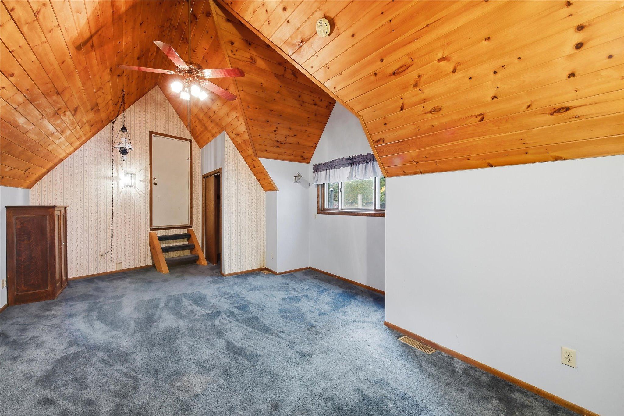 second bedroom up has access to an unfinished storage area over the 3 car garage