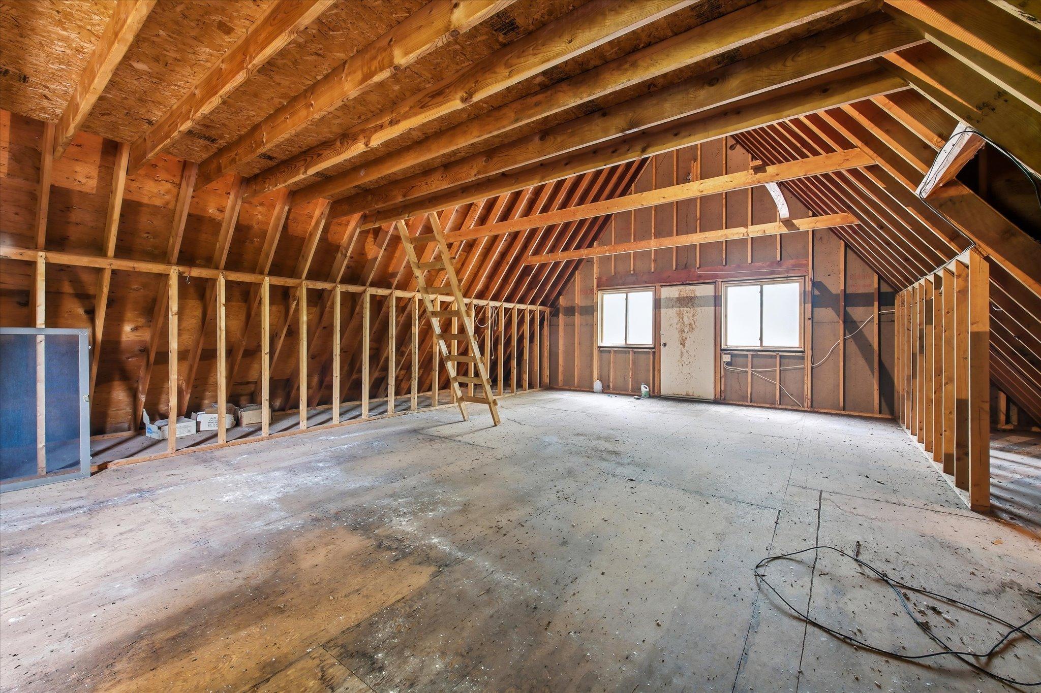 Unfinished storage space over the 3 car garage