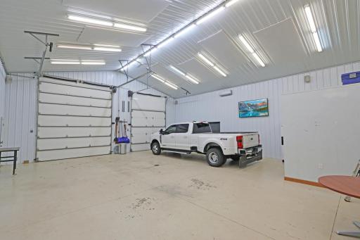12' and 10' overhead doors lead into the shop.