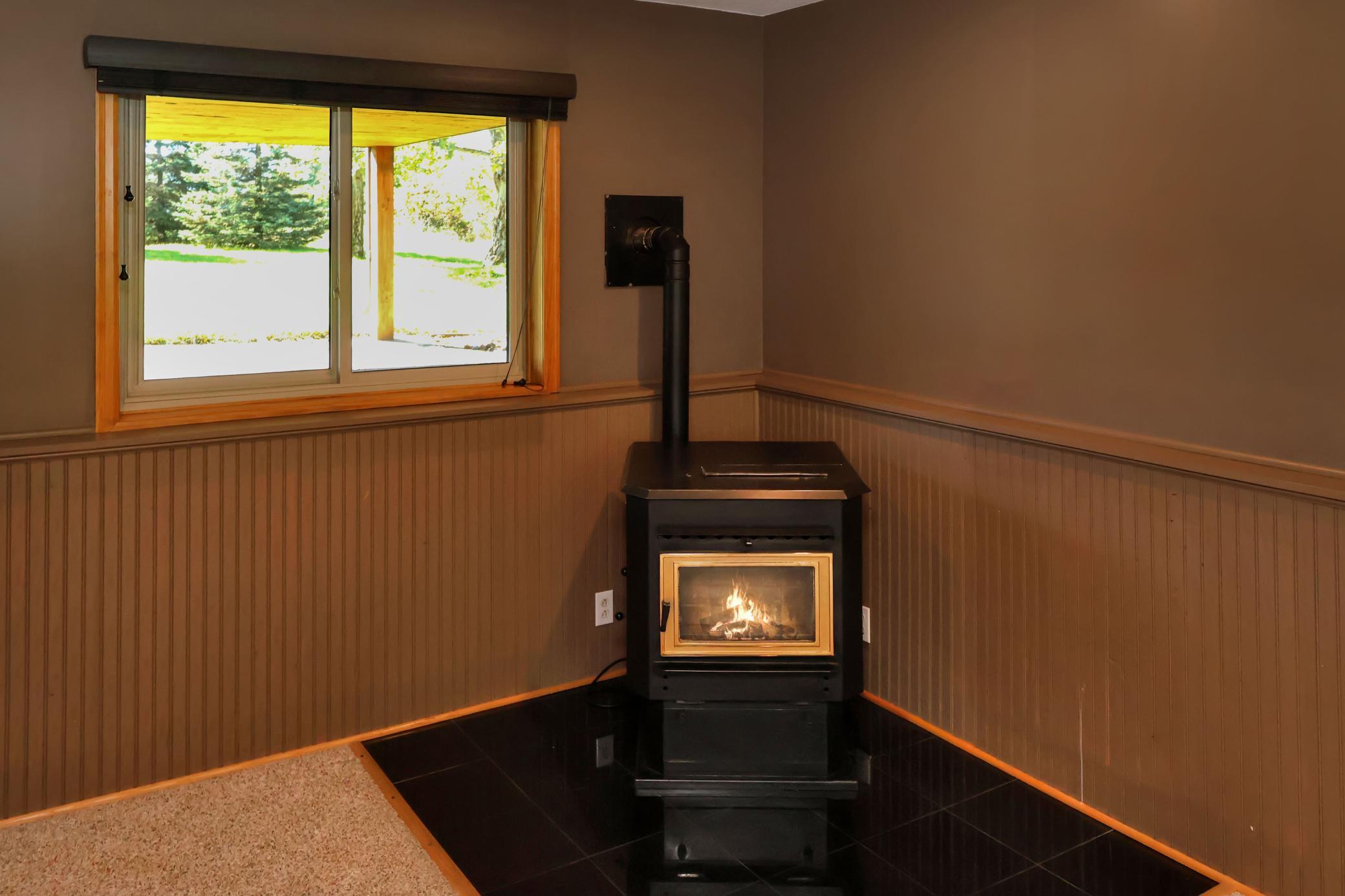 Cozy up by the pellet burning fireplace in the lower level family room.