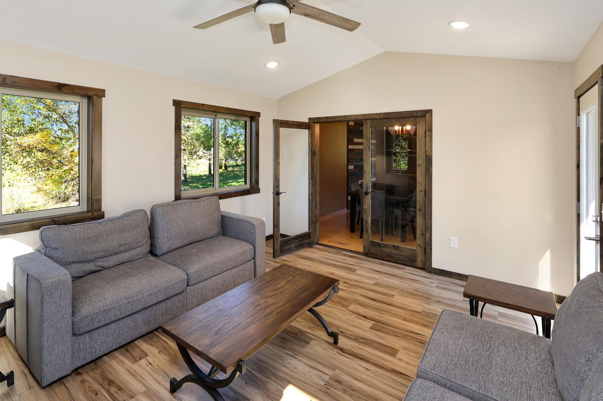 Beautiful French doors accent the transition from the dining area to the sunroom.
