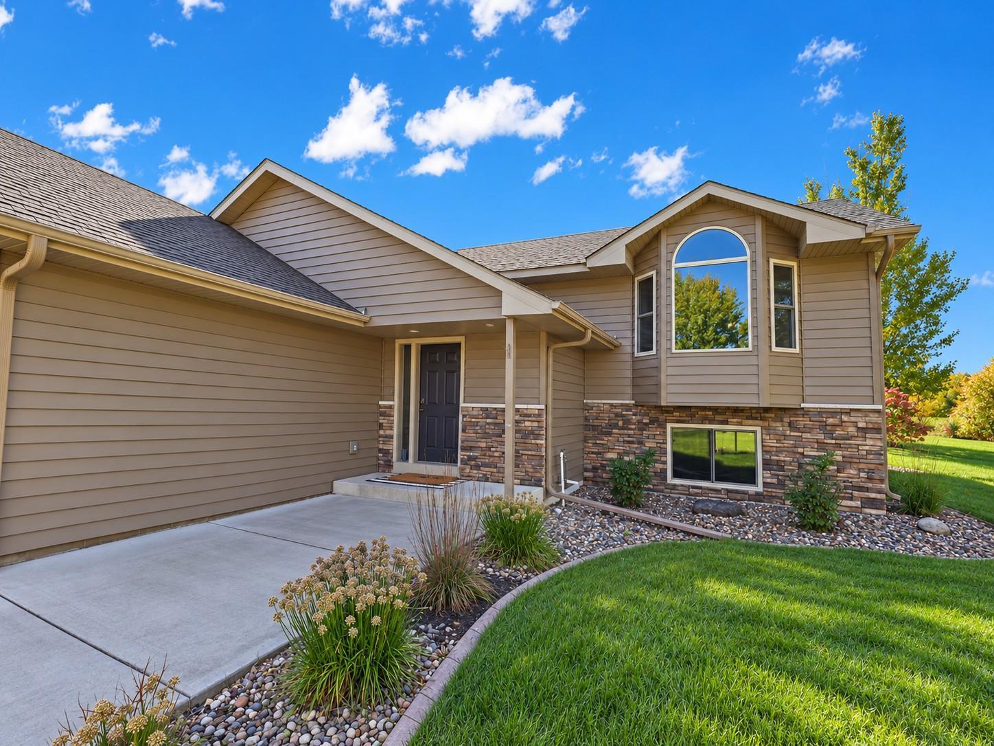 Inviting front entry accented by rock landscape.
