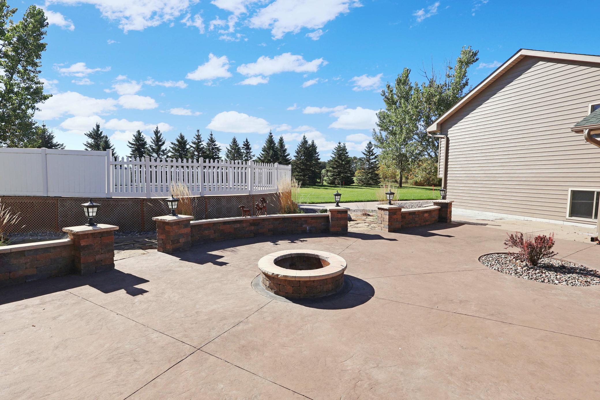 Great patio and firepit area leading to the pool deck- just needs a new liner!