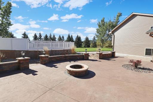 Great patio and firepit area leading to the pool deck- just needs a new liner!