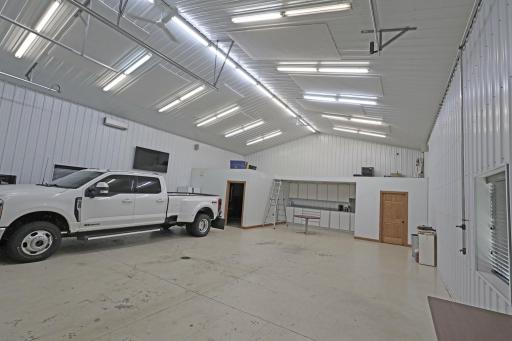 Spray foamed, heated and cooled shop with an office space and a half bath.