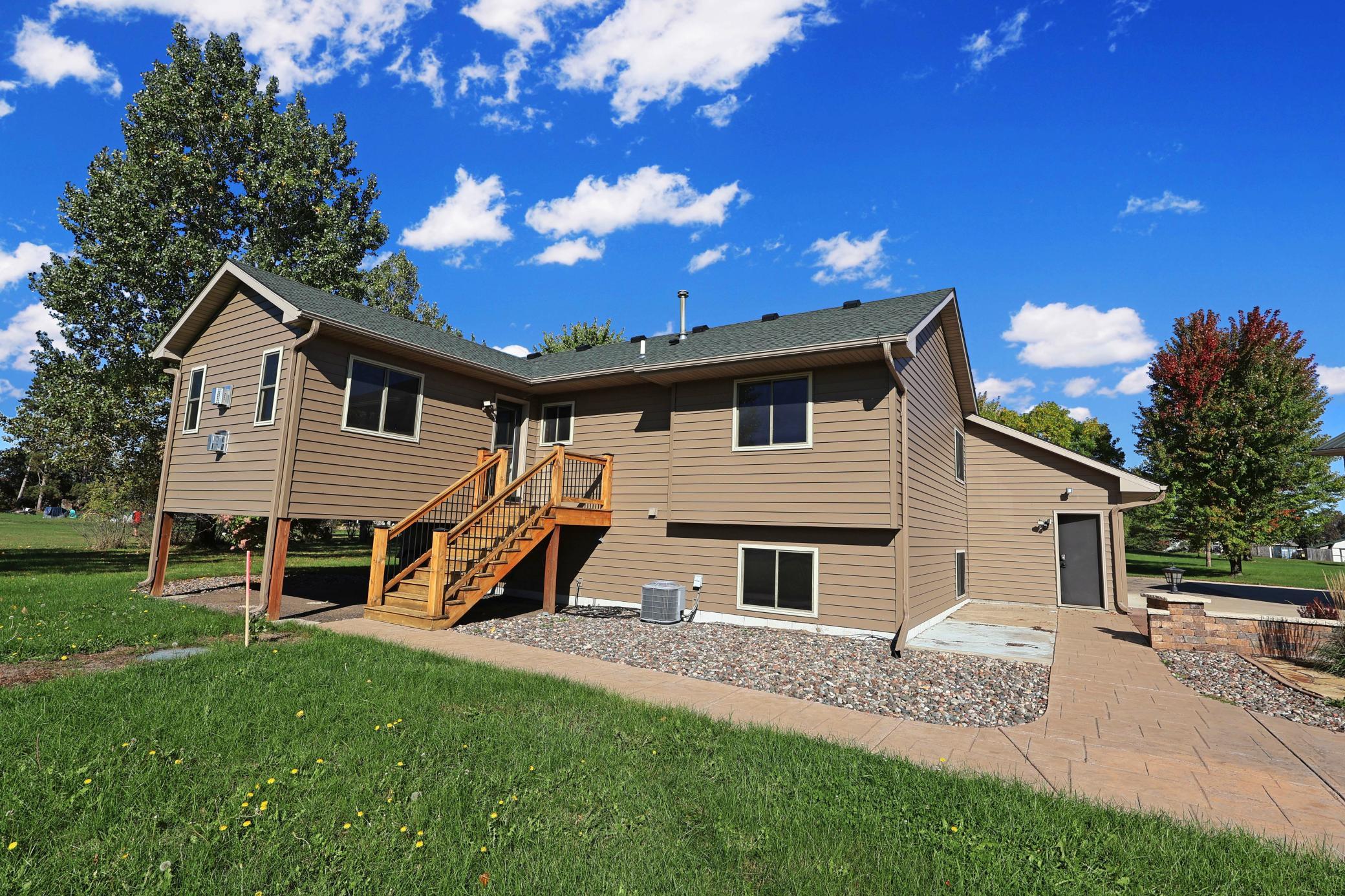 The four season sunroom off the back of the house leads to a deck down to the patio area.