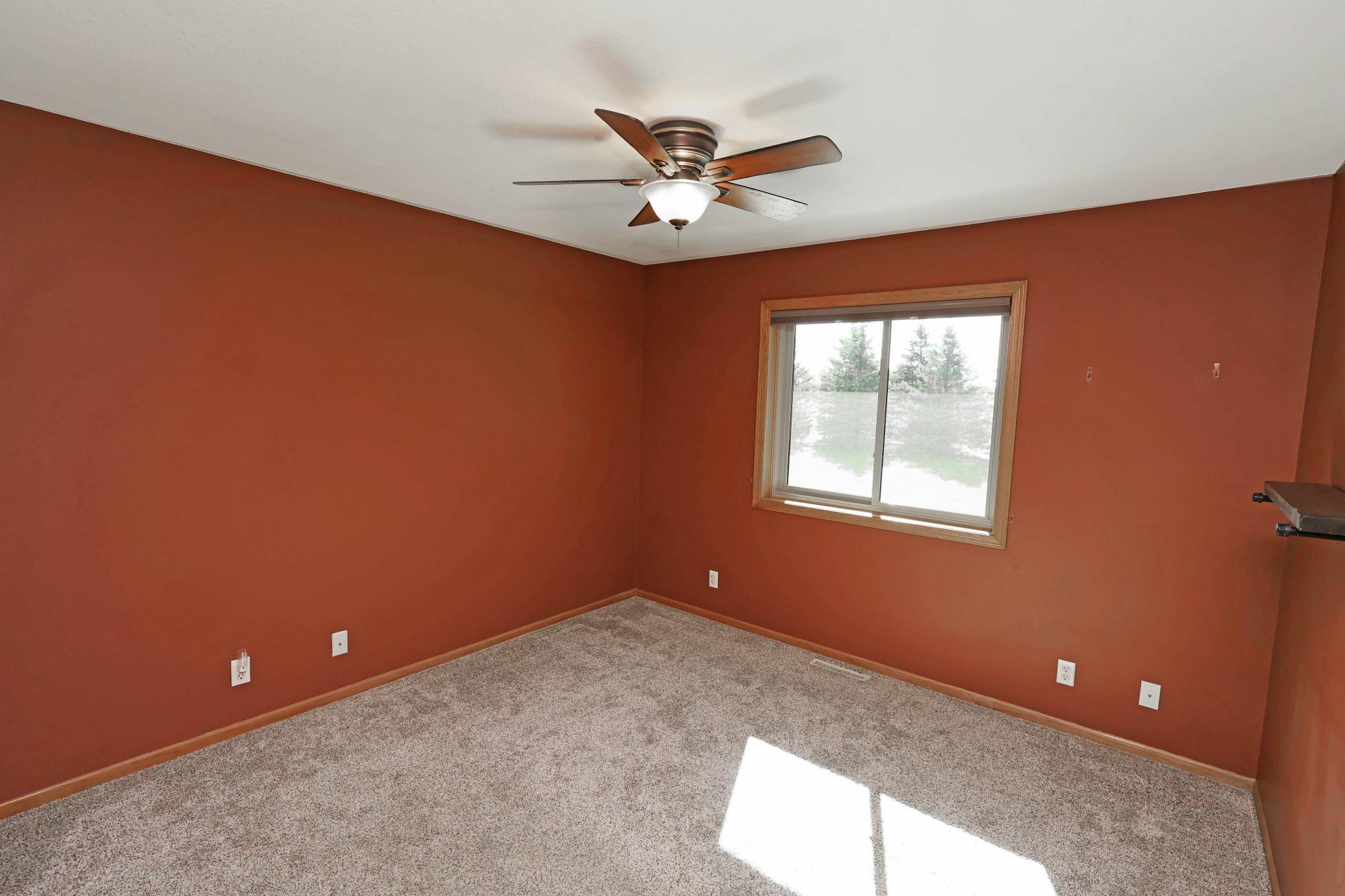 The primary bedroom faces the backyard for great views.